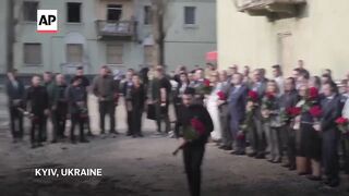 Zelenskyy visits Kyiv attack site where Russian strike killed at least 12.