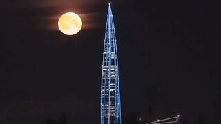 Mesmerizing view of the moon above the Lakhta Center skyscraper