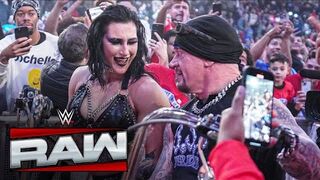 The Undertaker celebrates with Rhea Riple