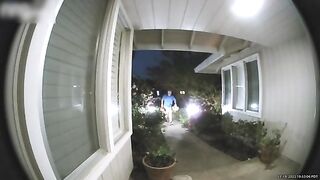 Man Trips and Falls While Walking Towards Front Door