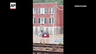 Flooding In Maryland sends cars floating.