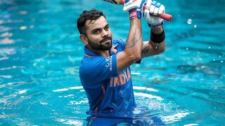 Virat Kohli playing cricket in water