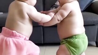 cute baby fighting both this two