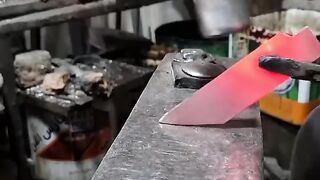Making pocket knife with engraved Buffalo logo.