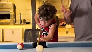 Funny brother plays pool
