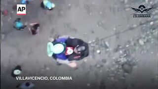 Colombian authorities carry out rescues after rafts and kayak capsize in deadly flash flooding.