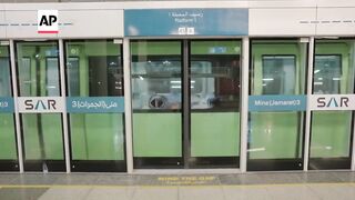 Pilgrims in Saudi Arabia use Metro system to travel between sacred sites during Hajj pilgrimage.
