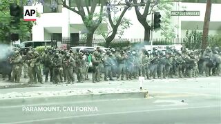 Protesters and immigration authorities face off for a second day in LA area after arrests.