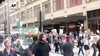 Protesters march through Chicago over immigration raids.