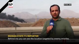 Iran state TV shows smoke rising from Natanz nuclear site after Israel attacks.