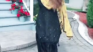 Amazing interesting beautiful girl in black and yellow dress