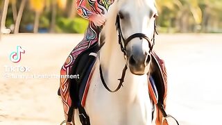 Perfectly Tattooed Body Beauty Riding a Horse