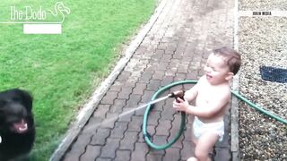 baby laughing at pet