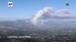 Firefighters battle wildfires in southern and central California.