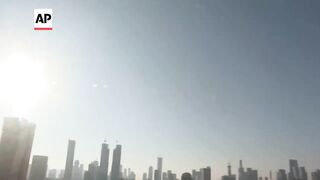 Sirens sound in Tel Aviv as Iranian missile barrage targets Israel.