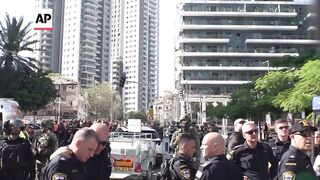 Scenes from central Israel after Iranian missile strike.