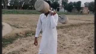 Weight lifting in one hand guess the weight and reply in coment