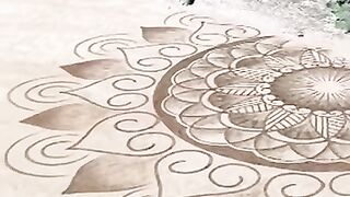 Young French Artist Transforms Beach into Stunning Sand Mandala