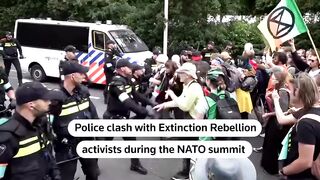 Clashes at NATO Summit as Police Confront Extinction Rebellion Protesters