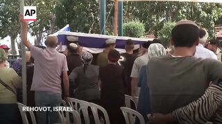 Family and friends attend funeral of Israeli soldier killed in Gaza.