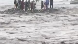 18 tourists were swept away by flash flooding while having breakfast by a riverside hotel near the Mingora