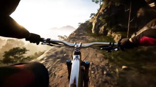 First-person POV of an extreme mountain biker gripping the chrome handlebars of a high-end trail bike