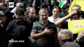 Coffins of Iranian generals and scientists killed in Israeli strikes arrive on trucks for