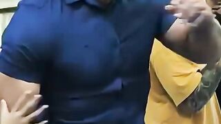 A bodybuilder displaying an angry attitude during an arm wrestling match.