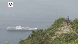 Chinese aircraft carrier sails into Hong Kong for first