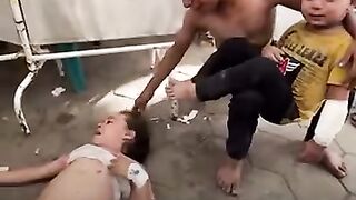 Heartbreaking Moment: Palestinian Boy Comforts Siblings After Israeli Strike