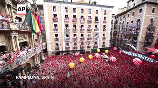Revelers pack Pamplona square to celebrate the start of San Fermín bull-running