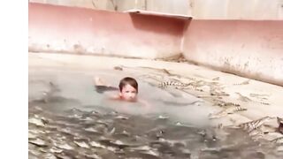 Kids Swimming With Crocodile| Can humans swim with crocodiles? Brave Kid Swim | #shorts #crocodile