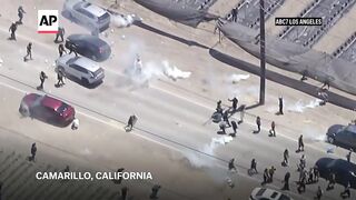 Protesters and federal agents clash during raid at California