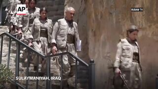Kurdish separatist fighters in Iraq lay down weapons as part of peace process with