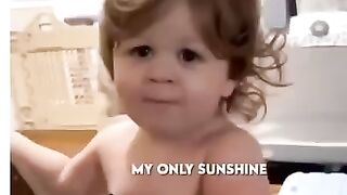 Cute boy sings  you  are my sunshine