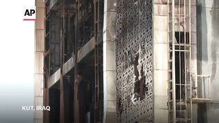 Aftermath of fire at Iraq shopping center, killing more than 60