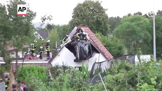 Several hurt as driver crashes car into a barn roof in