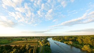 A Peaceful River Under the White Sky