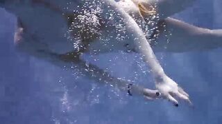 Girl swimming with no bra