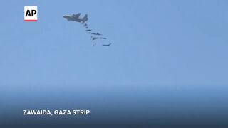 Palestinians in central Gaza run toward air-dropped food