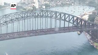 Thousands march across Sydney Harbour Bridge in support for Palestinians in