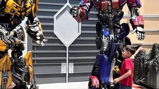 Optimus Prime and Bumblebee curious with smaller