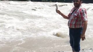 Tourists are enjoying the murmur and cool water of the Kunhar River.