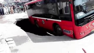 Bus Unbelievably Stuck on Road