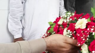 AD Asad places a bouquet of flowers at the shrine of Nusrat Fateh Ali Khan