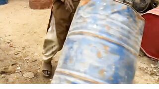 An Old Man Cutting Drum With Hammer shorts youtube trending drums hammer