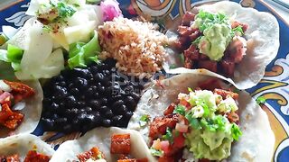 Soft open taco with chicken salsa and avocado Mexican Latin street food cuisine baked rice and beans salsa