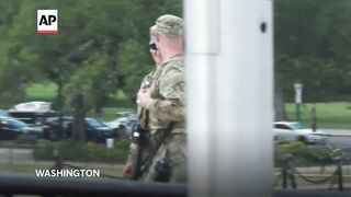 Tourists in Washington react to National Guard troops carrying