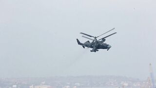 Military Halicopter Patrol Over The City