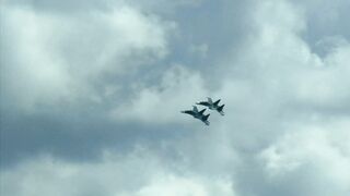 Military Aircraft Patrol in the Cloudy Sky